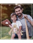Long-armed monkey holding baseball plush toy